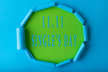 11.11 Single day sale. Blue circle torn paper with 11.11 Single days sale on green color background