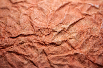 Extreme closeup of red handmade paper