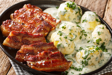 Stegt flaesk is a quintessential Danish dish which consists of grilled pork belly and new potato...