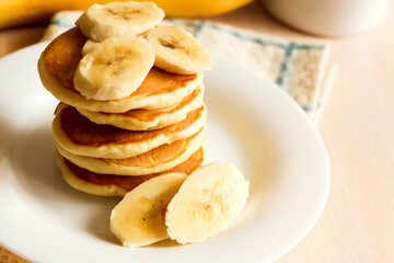 Obraz na płótnie Canvas Stack of pancakes with banana