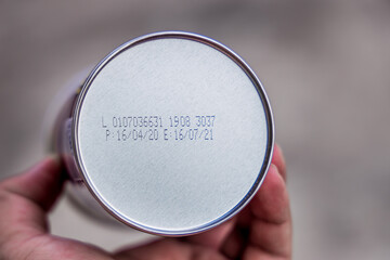 Packaged Date and Expire Date information on the bottom of the canned frozen food.