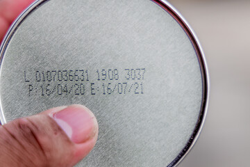 Packaged Date and Expire Date information on the bottom of the canned frozen food.