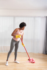 Black woman mopping the house