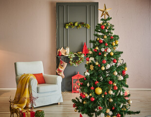 Fototapeta na wymiar Close up fir tree and gift box, classic fireplace grey style and stone wall decoration.