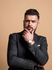 elegant businessman wear formal suit. unshaven stylish guy has groomed hair. male beauty and...