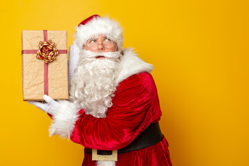 Santa Claus holding Christmas present