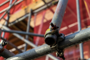 A close up of scaffolding poles on the front of a building