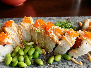 California roll sushi lunch with edamame beans, chili mayonnaise, white roe and seaweed