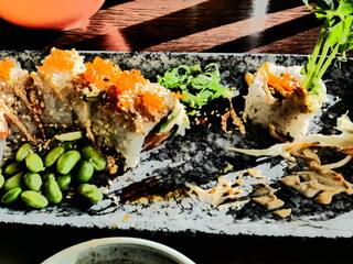 California roll sushi lunch with edamame beans, chili mayonnaise, white roe and seaweed