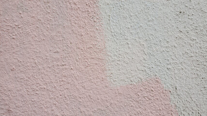 Rough plaster wall surface closeup. Pink stucco texture