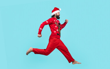 Fototapeta na wymiar Full length photo of cheerful running man ready to celebrate winter holiday, winter holiday