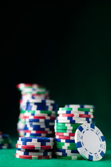 Fototapeta premium Colored poker chips on a table in casino