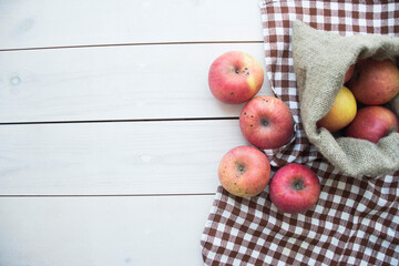 ripe apples on a wooden background