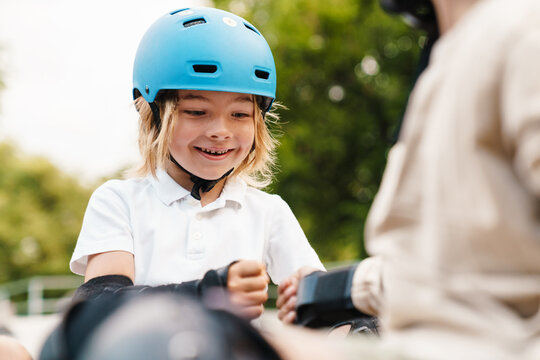 Young Girl Skateboarder Wearing Helmet