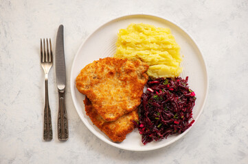 Chop pork cutlets , served with mashed potatoes and beetroot salad. - obrazy, fototapety, plakaty