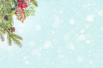 Christmas and New Year greeting card background. Xmas backdrop with fir tree branches, decoration and snowfall on wooden white board