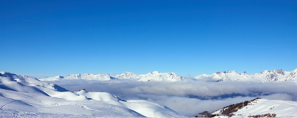 Fototapeta na wymiar Panoramic view of the mountains near Tignes high-altitude ski resort in France during the winter season.