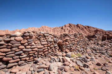 Remnants of rock structures in Tambo de Catarpe, Catarpe Valley in the Atacama Desert, Chile