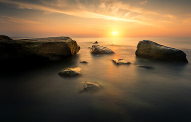 Fototapeta na wymiar Sunset over the Baltic Sea. Piastowskie Stones