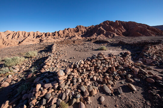 Remnants of rock structures in Tambo de Catarpe, Catarpe Valley in the Atacama Desert, Chile