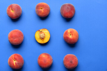 Sweet peaches on color background. Concept of uniqueness