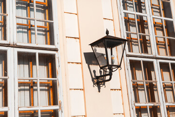 Old style street lamp with wall support
