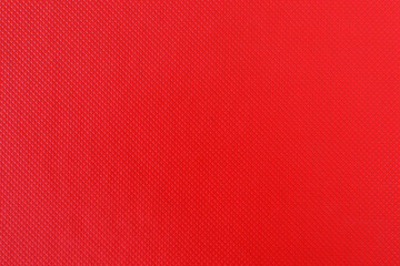 Tax file folder scaly red texture background, macro photo