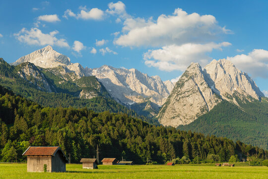 Hay barns at Hammersbach Footpath against Wetterstein Mountain Range, Garmisch-Partenkirchen, Werdenfelser Land, Upper Bavaria