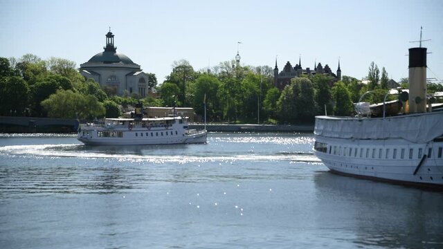 Fast going Commuter boat Mysing leaving the pier Str&ouml;mkajen for the Stockholm archipelago an early sunny da