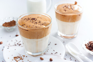 Cold drink with coffee, milk, sugar and water, dalgona coffee, horizontal