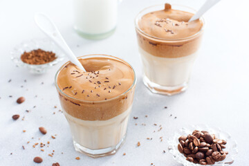 Cold drink with coffee, milk, sugar and water, dalgona coffee, horizontal