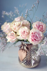 Beautiful fresh roses on a table. Soft focus.
