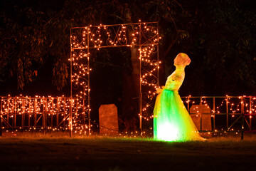 Illuminated Halloween ghosts decoration outdoor at night