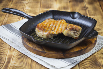 Pork fillet chops in a pan. Grilled meat. High quality photo