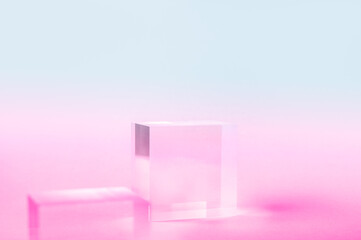 Acrylic Solid Display Block for Shop Windows on bright pink and blue gradient background, empty...