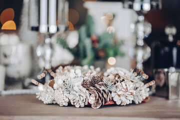 Silver decorative Christmas wreath made of natural materials. New Year eve concept
