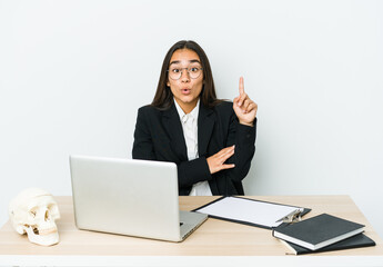 Young traumatologist asian woman isolated on white background having some great idea, concept of creativity.