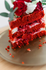 cut cake red velvet with fresh flowers on a gold tray