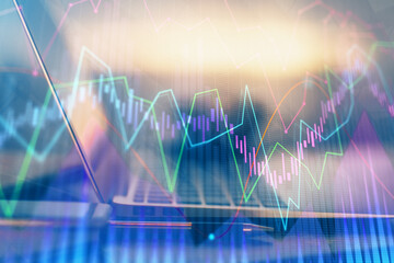 Forex Chart hologram on table with computer background. Multi exposure. Concept of financial...