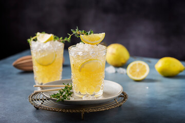 Cocktail with lemon, timo and crushed ice