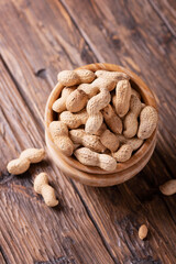  Roasted peanuts in wooden bowl