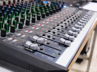 Mixer equipment is dirty with dust. The sound control mixer in use has nasty dust. Focus closely and choose the subject.