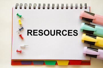 the resources text is written on a white notepad. Enterprise resource planning concept. Business structure and many business icons.