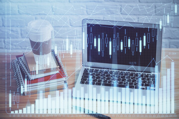 Multi exposure of graph and financial info and work space with computer background. Concept of international online trading.