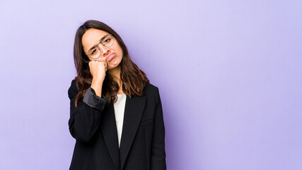 Young mixed race hispanic woman isolated who feels sad and pensive, looking at copy space.