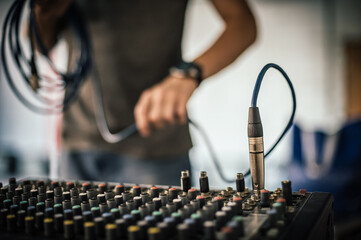 Behind the scene. Sound technician electric engineer adjusting sound elements backstage. Control...