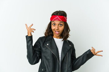 Young latin rocker woman isolated on white background