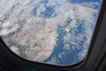 Aerial view of Tenerife with clouds in the foreground. Tenerife from the airplane.