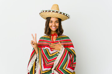 Young mexican woman isolated on white background