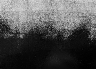 light wall is partially painted black with a roller. Background, texture